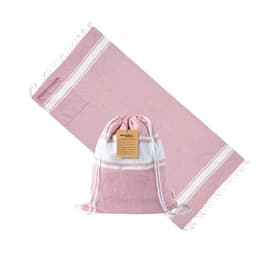 A pink and white Carey drawstring bag next to a matching pink towel, featuring a tag and soft fabric.
