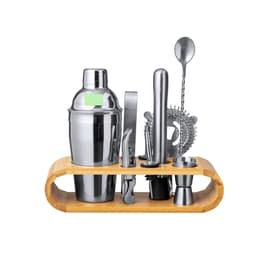 A stainless steel cocktail shaker set with a bamboo stand, including various cocktail tools and a strainer.