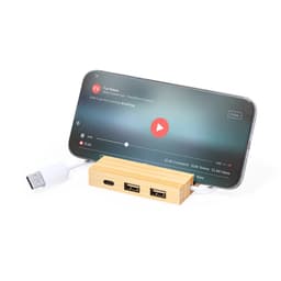 A bamboo USB hub with multiple ports, connected to a smartphone displaying a video.