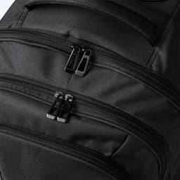 A black wheeled backpack featuring multiple zippered compartments and a smooth fabric finish. It has a logo.
