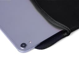 A black tablet cover partially unzipped, revealing a silver tablet inside. The cover features a logo.