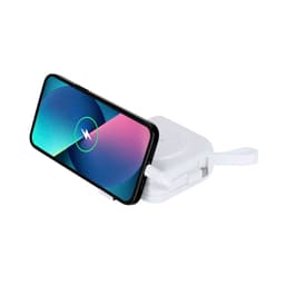 A compact white travel cable with a smartphone resting on it, featuring a circular charging pad.