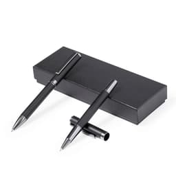 A set of two black metal pens positioned on a sleek black gift box, featuring a logo.