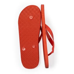 A pair of red thongs with a textured sole and flat straps, featuring a logo on the surface.