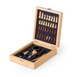 A wooden chess set in a box, featuring light and dark pieces, a storage compartment, and accessories for gameplay.