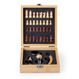A wooden chess set with light and dark pieces, displayed in a bamboo box along with wine accessories.