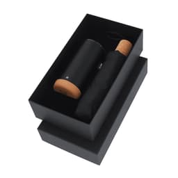 A drink bottle and a black umbrella enclosed in a sleek black gift box, featuring a cork lid.