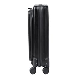A wheeled bag in black with a sleek, hard-shell design and smooth-rolling wheels.