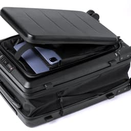 A black wheeled bag with an open lid, revealing a padded compartment for a laptop and other items.