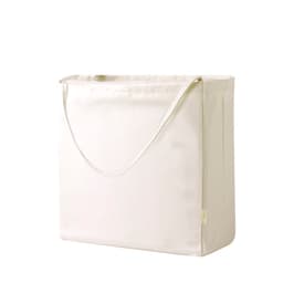 A plain cream tote bag with a single strap and a simple design, featuring a logo.