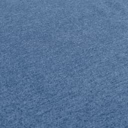A blue t-shirt made from a textured fabric, featuring a small logo.
