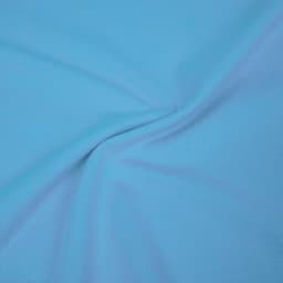A light blue T-shirt with smooth fabric texture, featuring a logo. Suitable for kids.
