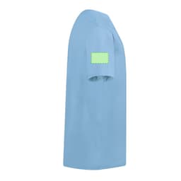 A light blue children's T-shirt with a blank green patch on the sleeve.