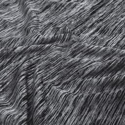 A textured fabric featuring a mix of grey tones, illustrating the material of the Kassar T-Shirt.