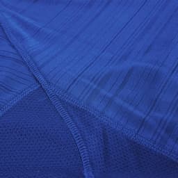 A blue Kannur T-Shirt featuring a textured pattern with breathable mesh details and a logo.