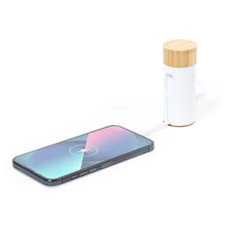A power bank with a bamboo top and white body, connected to a smartphone with a charging cable.