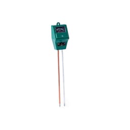 A moisture meter with a green body and two probes, one copper and one metallic, for measuring soil moisture levels.