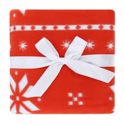 A vibrant red Yalanny blanket with a snowflake pattern, neatly tied with a white ribbon.