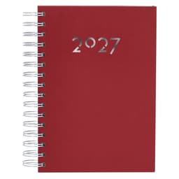 A red spiral-bound diary with a silver emblem displaying the year 2027 on the front cover.