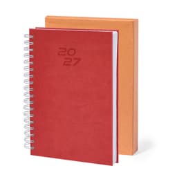 A red diary with a spiral binding placed next to an orange cover. The diary features the year '2027'.