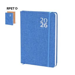 A blue diary with a textured cover, featuring the year "2026" and a matching elastic band. Includes a smaller diary in the background.