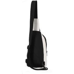 A single-strap bag in black and white, featuring a mesh panel and zippered pocket. It has a logo on the front.