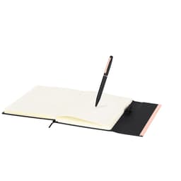 A black and pink notebook with blank pages and a black pen resting on top, featuring a logo.