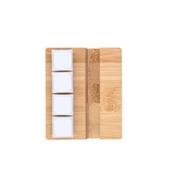 A bamboo serving board with three square white ceramic dishes arranged in a row.