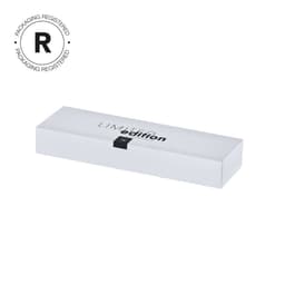 A sleek white box with a black band, labelled "Limited Edition," featuring a logo on the front.