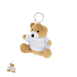 A plush teddy bear keyring in light brown, wearing a white shirt, attached to a metal keyring.