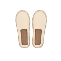 A pair of cream-coloured slip-on espadrilles with a textured jute sole. The shoes feature a stitched border.