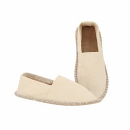 A pair of cream-coloured slip-on shoes with a natural woven sole and a simple design. Features a logo on one shoe.