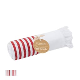 A rolled towel with red and white stripes, featuring fringed edges and a card tag.