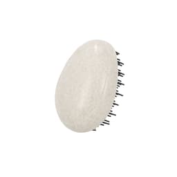A hair styling brush with a smooth, oval-shaped white body and black bristles, featuring a branding logo.