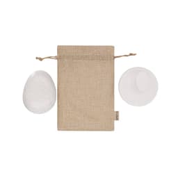A natural jute pouch with two smooth, oval stones in white, part of the Puxar Gift Set for health and beauty.