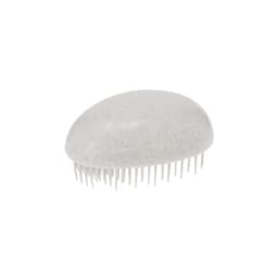 A white hairbrush with a textured surface and flexible bristles. The product has a rounded design.