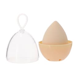 A beauty blending sponge in a beige colour, featuring a protective clear case and a base for storage.