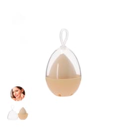 A beauty sponge stored in a clear egg-shaped container, featuring a beige sponge and a white string for hanging.