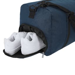 A navy duffle bag with a compartment revealing a pair of white sneakers inside, featuring a simple design and a shoulder strap.