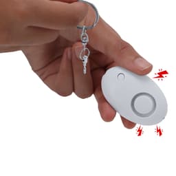 A white remote control device held in a hand, attached to a keyring, featuring a button and light indicator.
