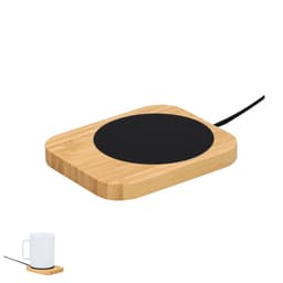 A bamboo coaster with a black circular heating pad and a white mug beside it, designed for keeping drinks warm.