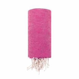 A pink towel with white fringes, neatly rolled up. It features a subtle texture and branding.