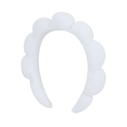 A white headband with a textured, scalloped design. It features a logo on one side.