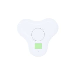 A white, compact wireless charging pad with a circular design and a small green indicator panel.