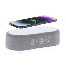A wireless charger in grey with a digital clock display, featuring a phone positioned above it.