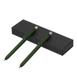 A sleek black box containing two green pens with silver accents and a simple design.