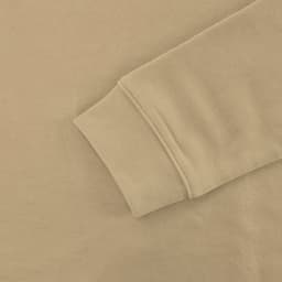 A beige hoodie sleeve with a smooth texture and a stitched cuff, featuring a simple design and no visible branding.