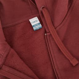 A maroon hoodie featuring a zip front, drawstrings, and a tag showing the name 'Astro'.