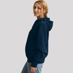 A navy hoodie is displayed, featuring a front pocket and a hood, worn by a model facing sideways.