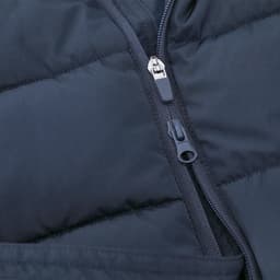 A dark blue puffer jacket featuring a zippered front and quilted texture. It includes a logo on the design.